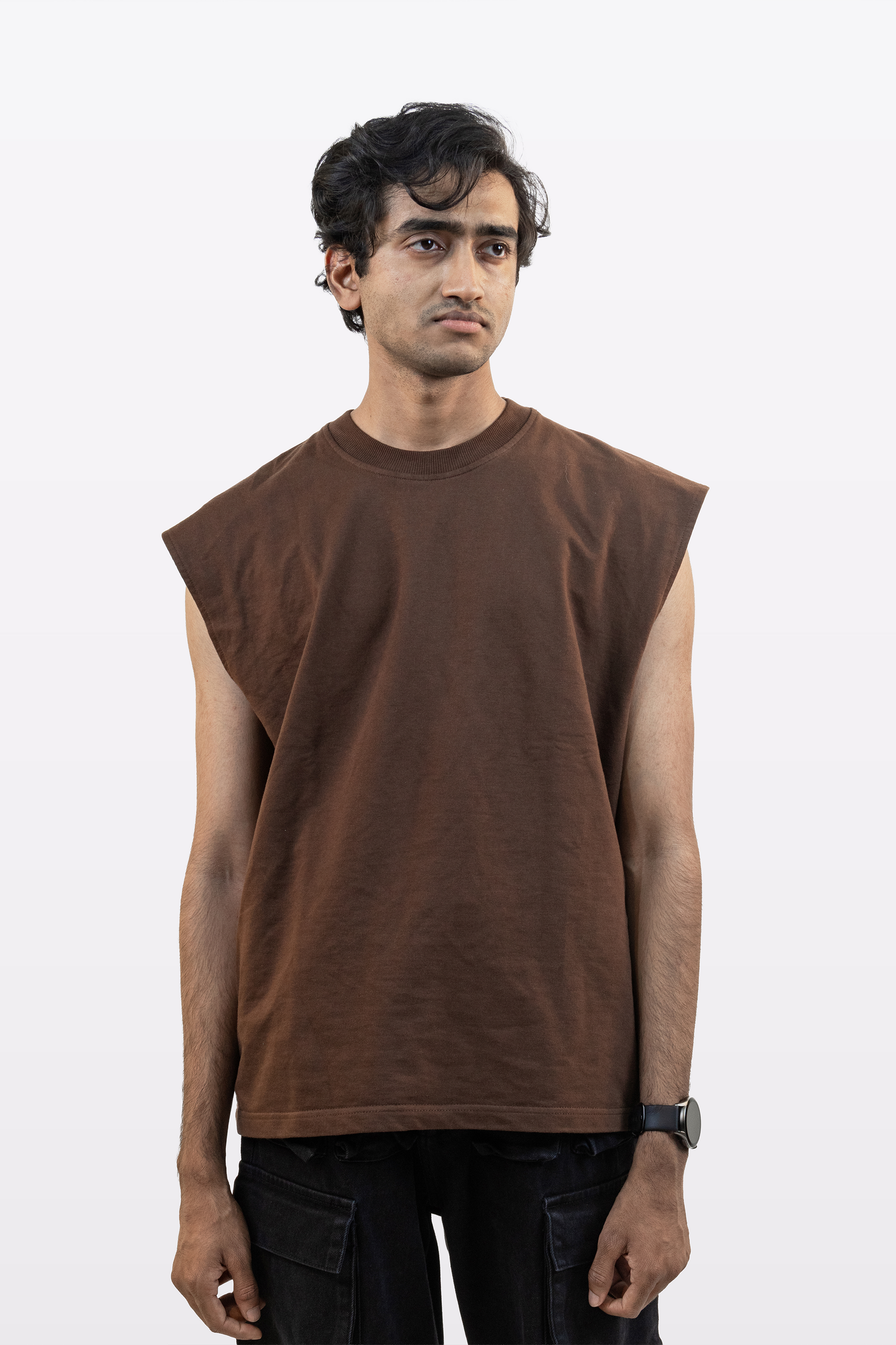 A male model wearing a cacao brown foundation tank, front view, against a white background.
