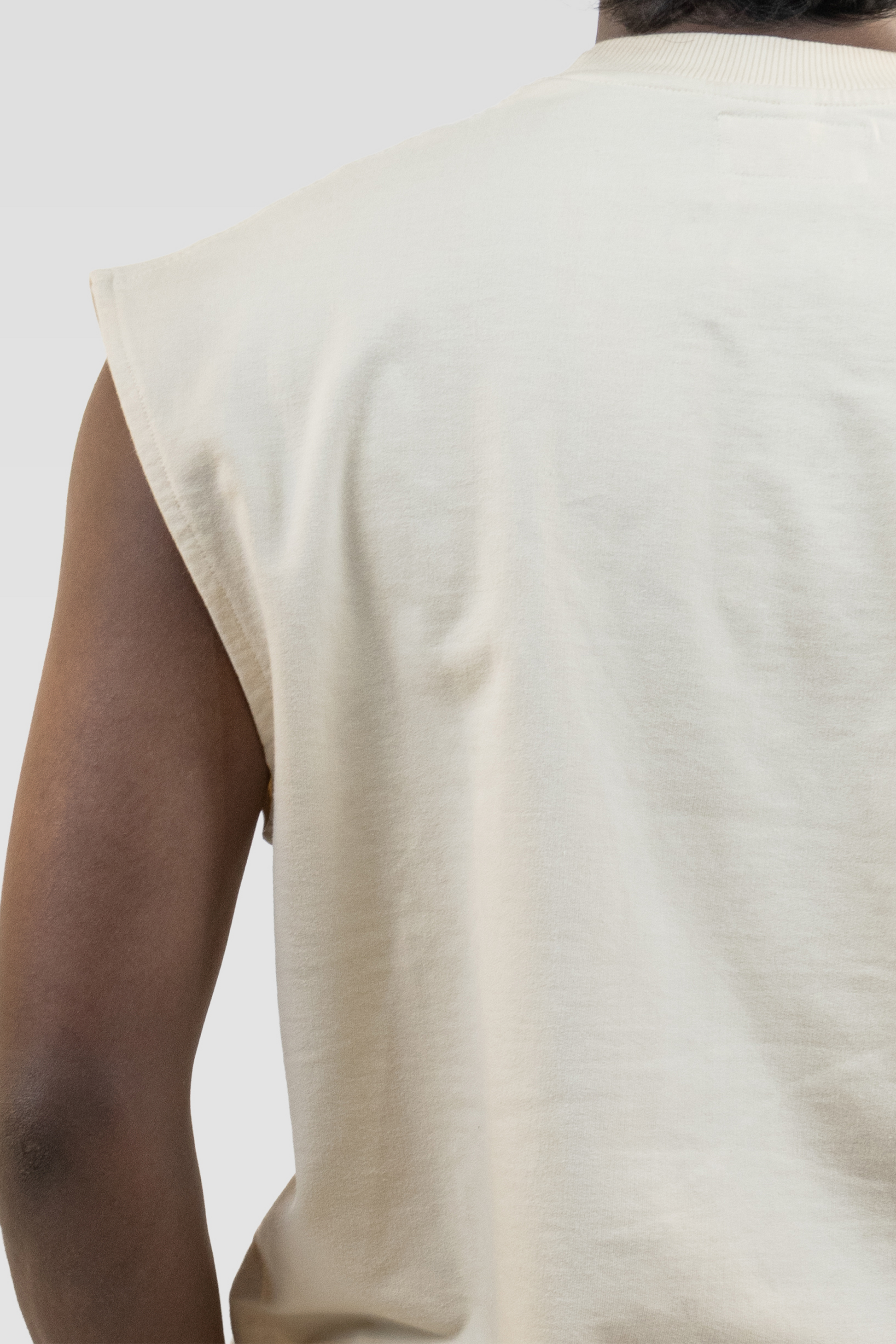 Close-up back detail of the Harper Slein Foundation Tank in OG Off White, showing fabric texture and sleeveless cut.
