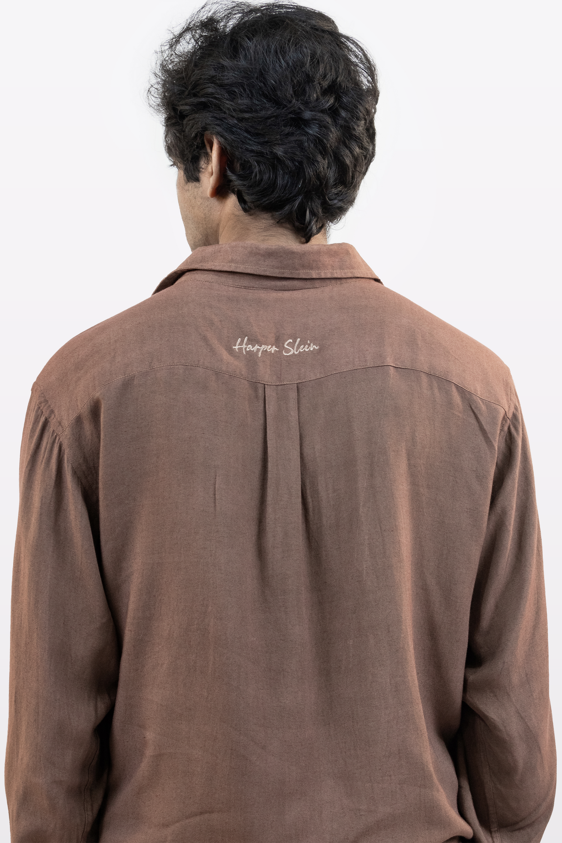 Harper Slein brown Contour Shirt back view with embroidered logo, worn by a model against a white background