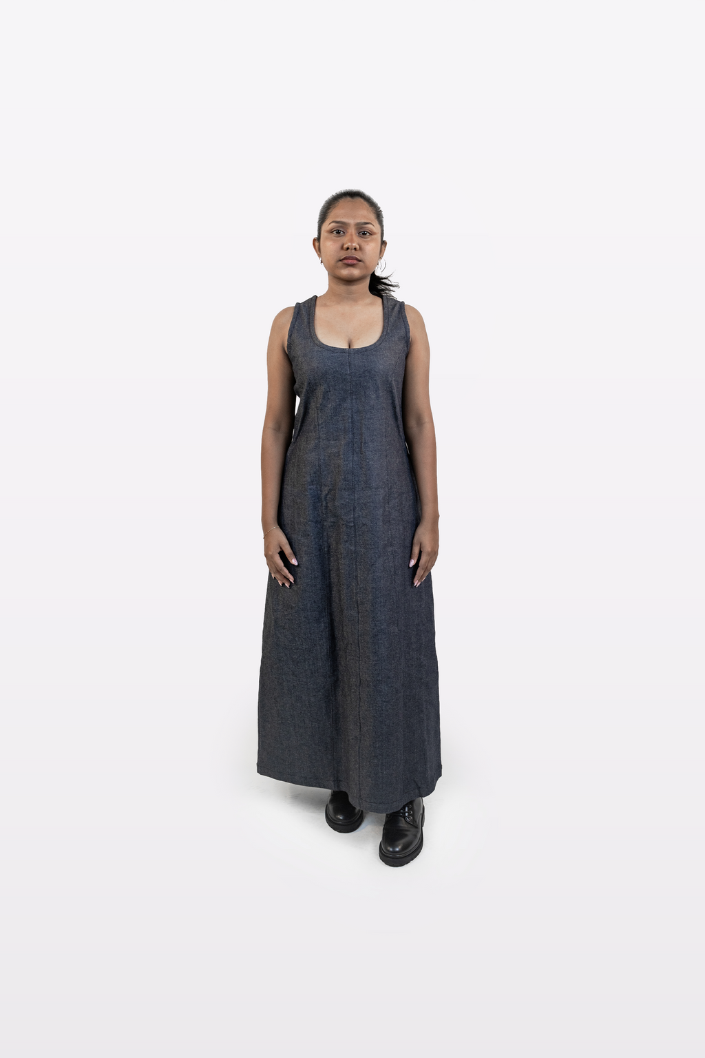 Model wearing Harper Slein sleeveless denim dress, front view, on a white background.