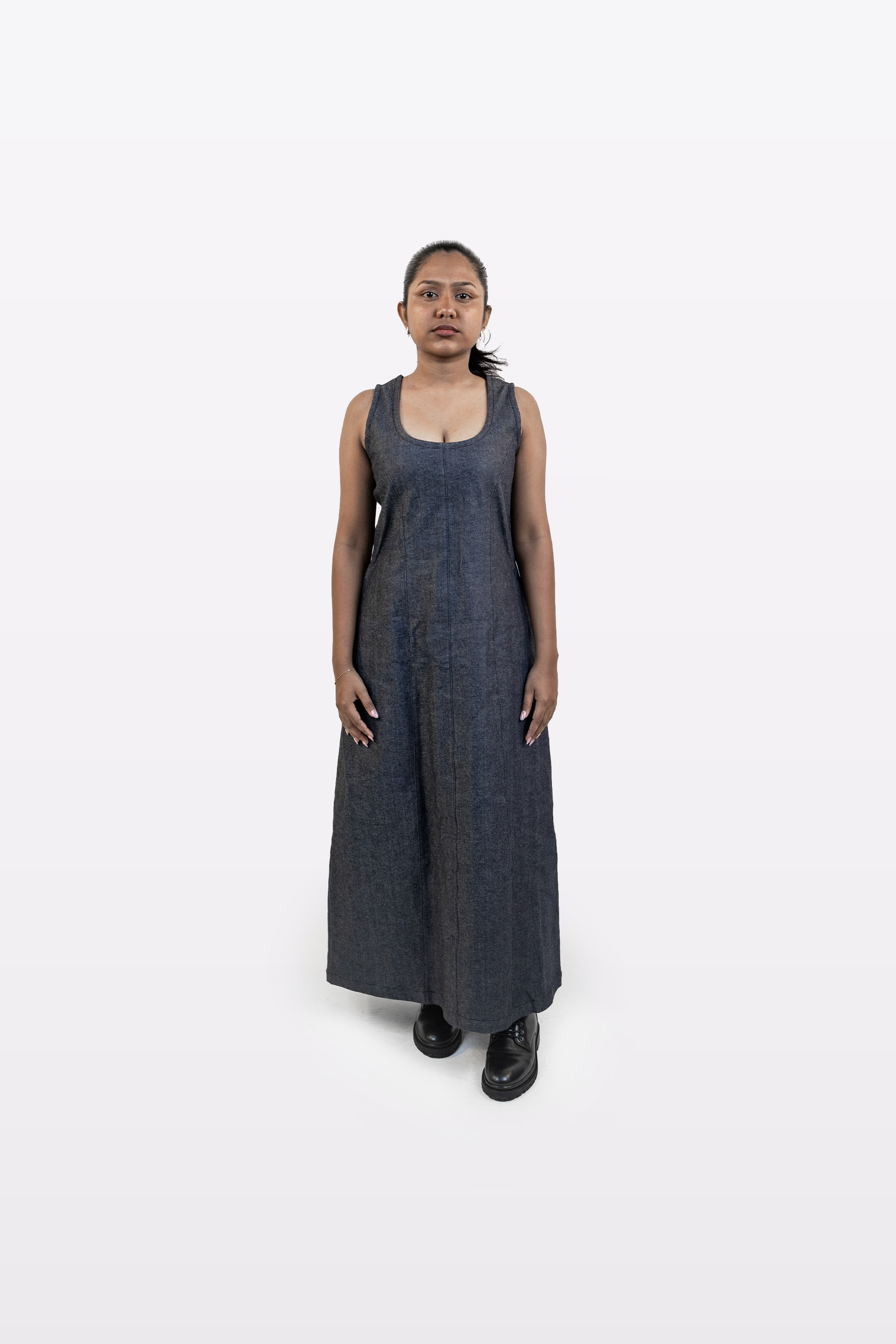 Model wearing Harper Slein sleeveless denim dress, front view, on a white background.
