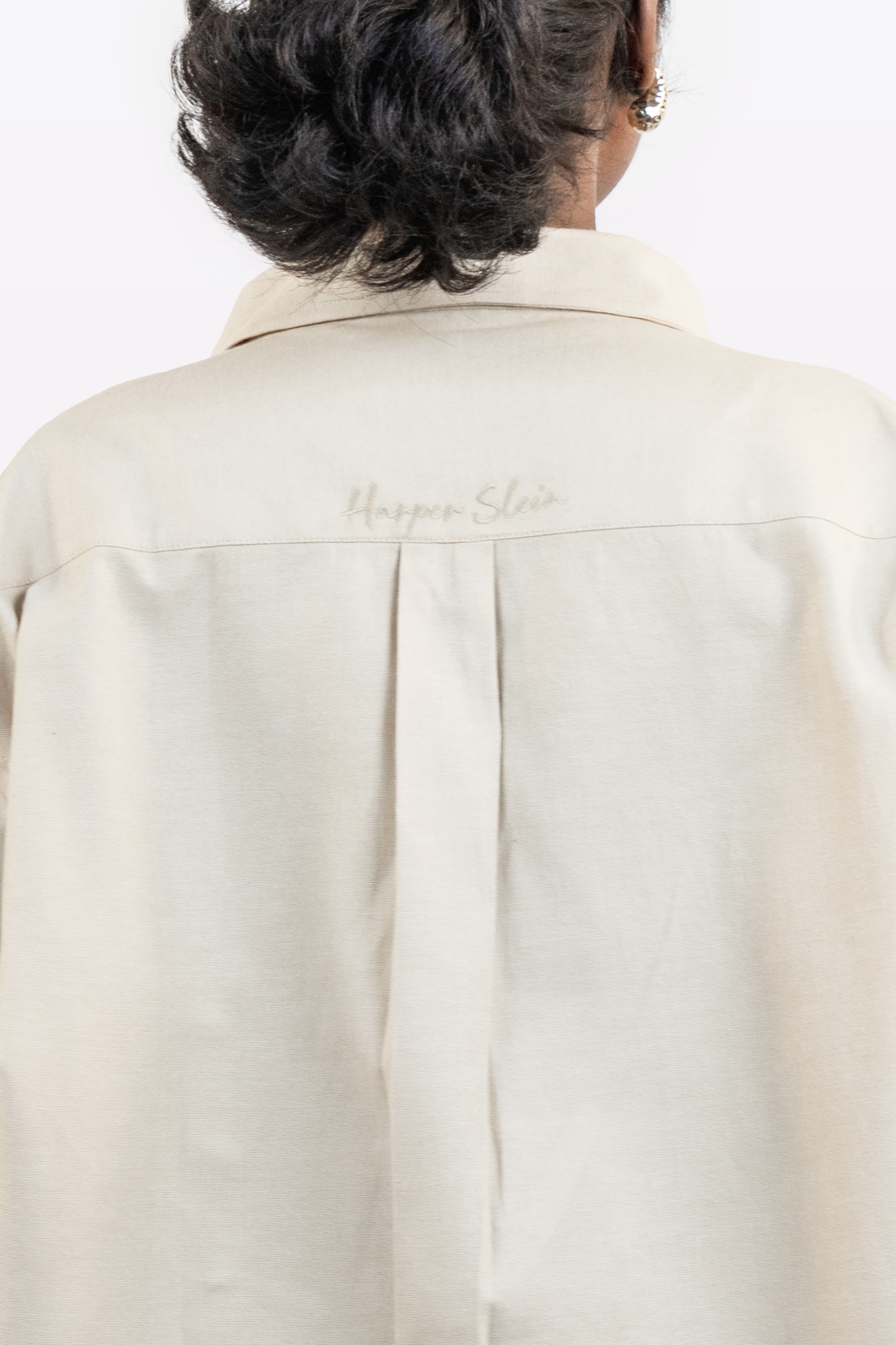 Back view detail of the Harper Slein Off White Oxford Shirt showing subtle branding on a white background