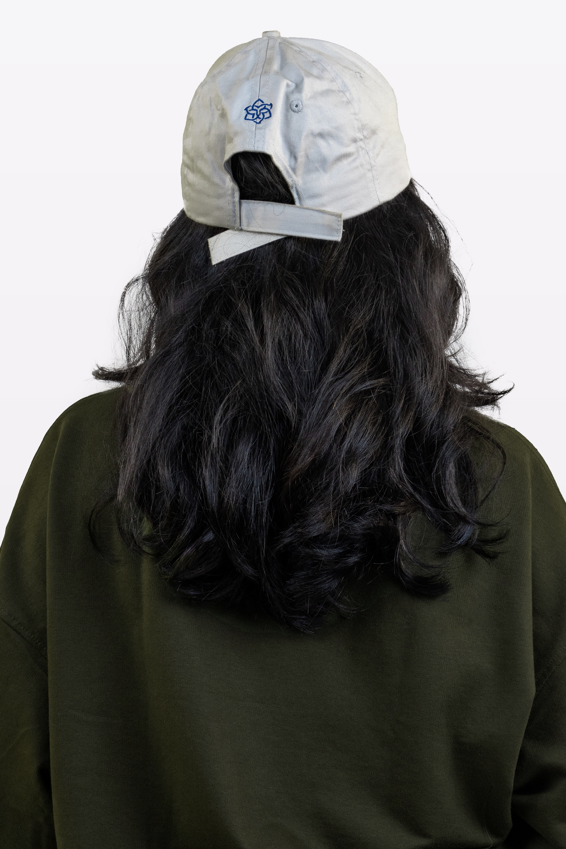 Back view close-up of a model wearing the Harper Slein oversized t-shirt in Nori Seaweed Green, against a white background.