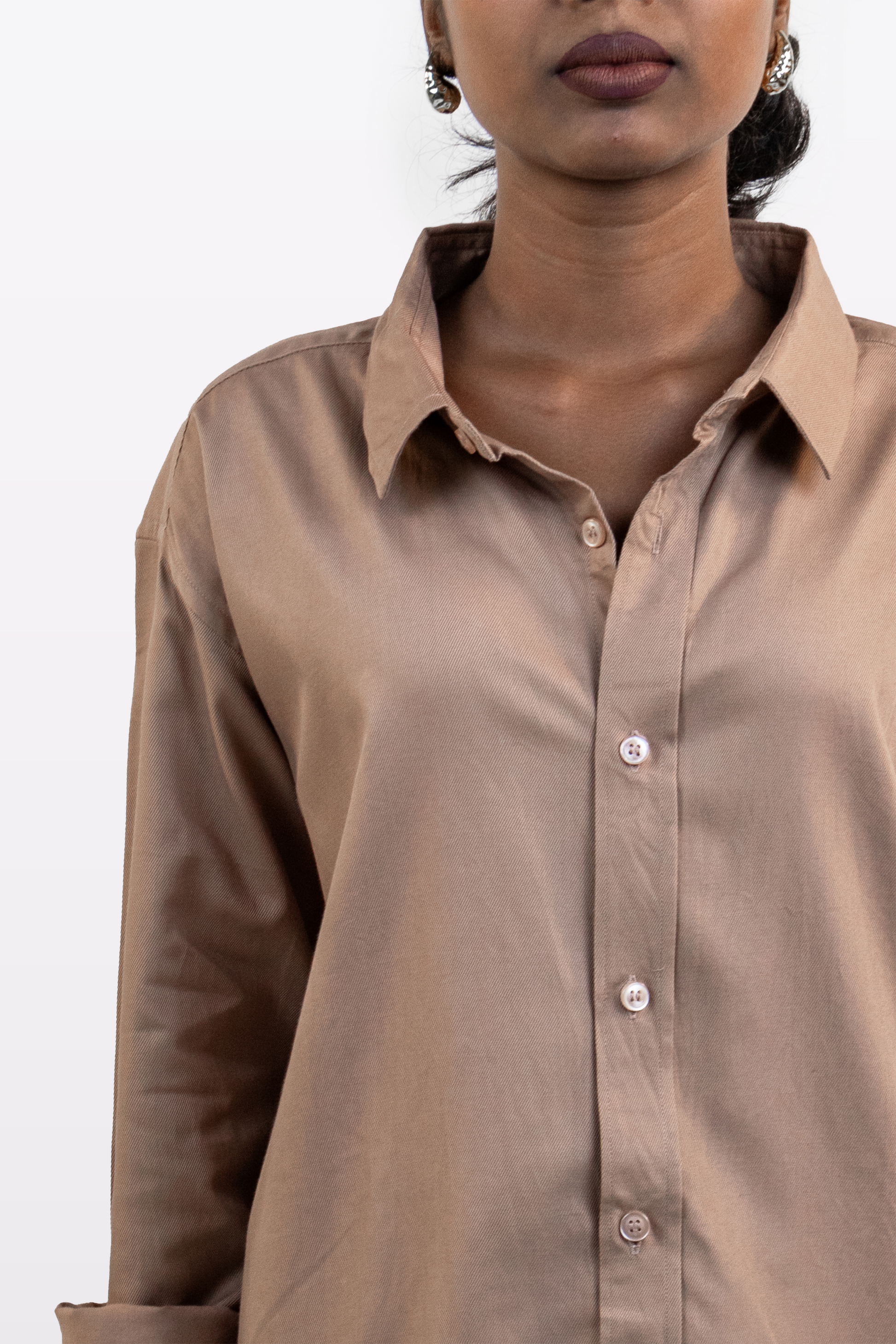 Model wearing Harper Slein brown Oxford shirt, close-up front view, on a white background.