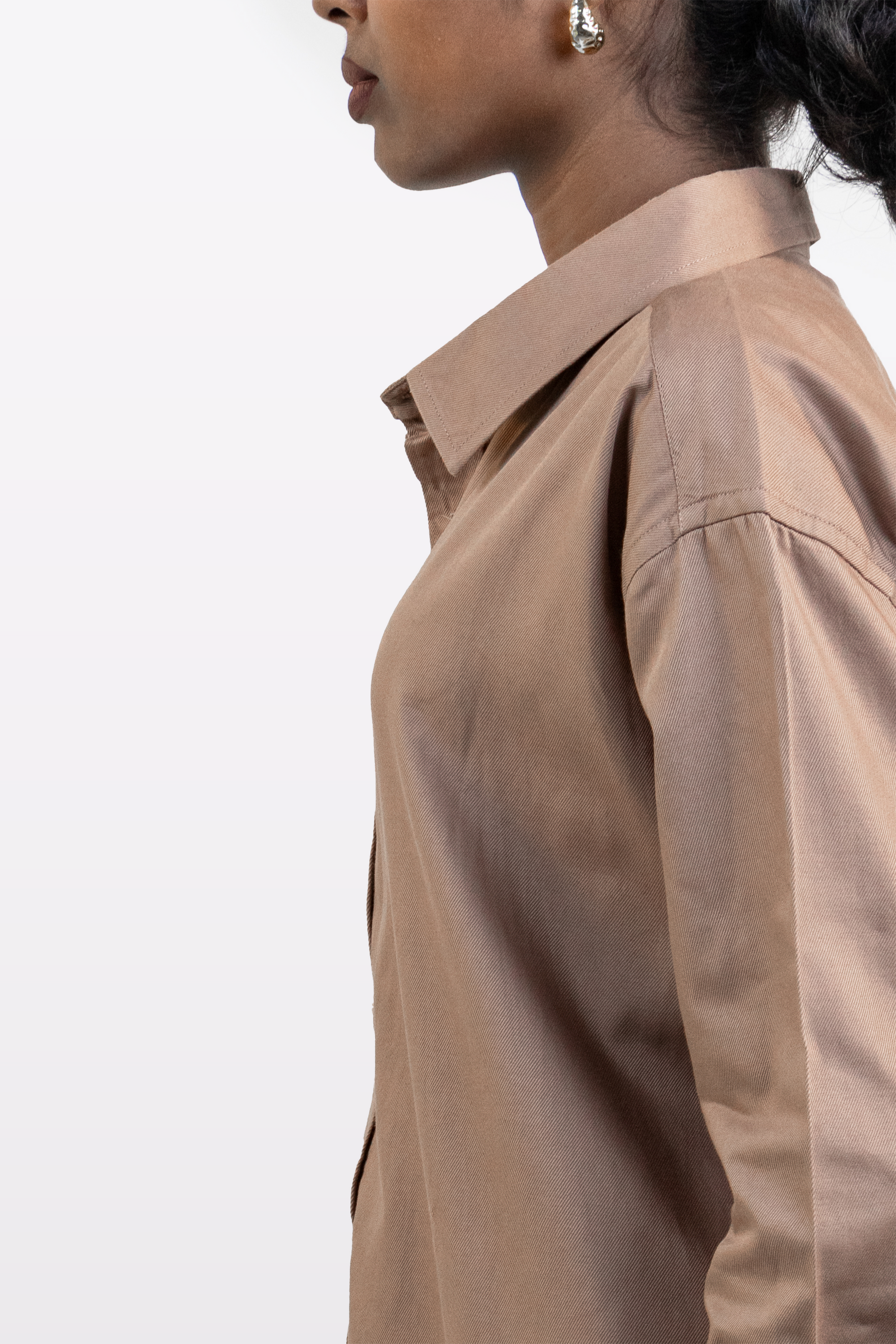 Right side close-up of a model wearing the Harper Slein Brown Oxford Shirt on a white background.