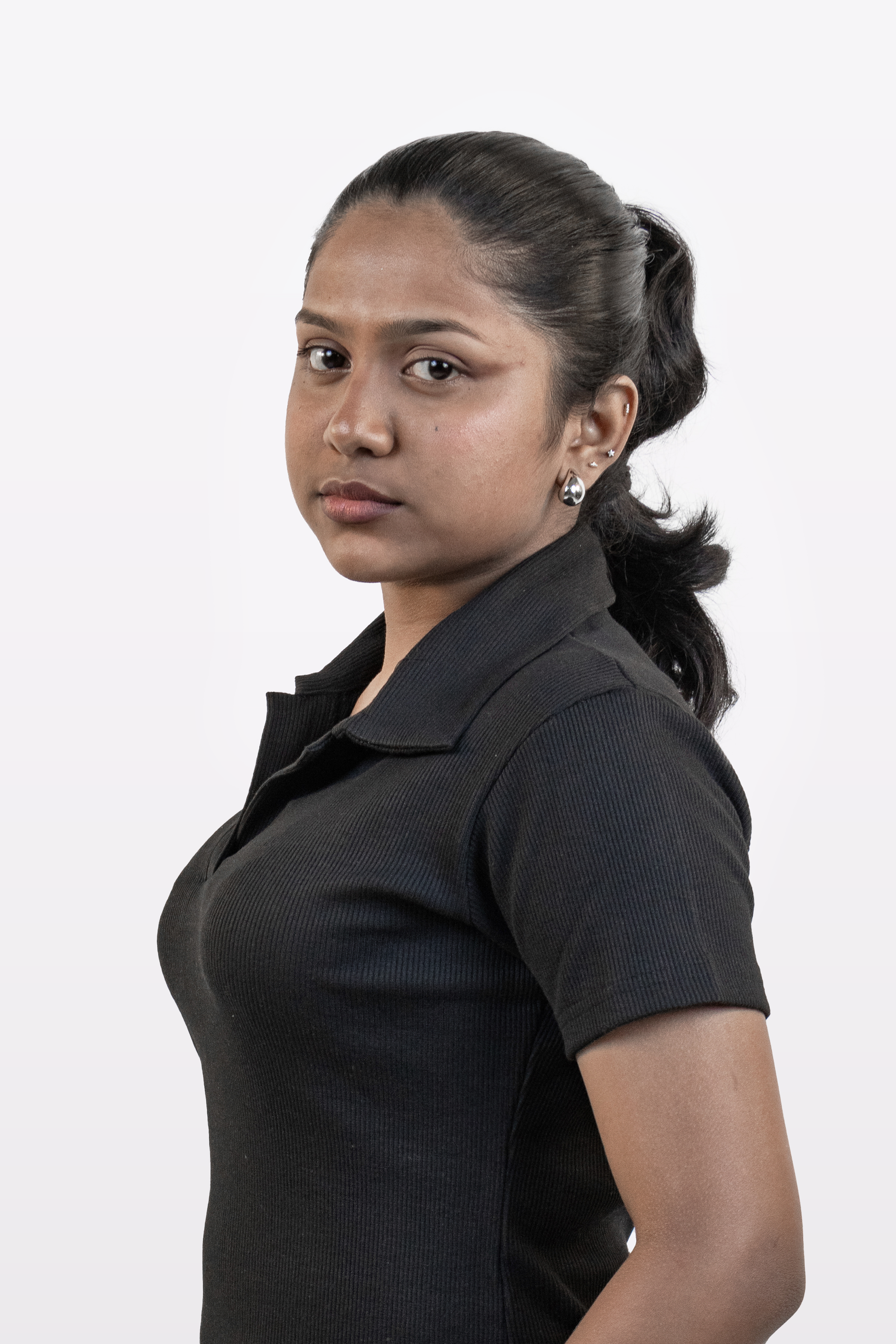 Close-up view of model wearing Harper Slein ribbed black polo t-shirt, highlighting collar and fabric texture, on a white background