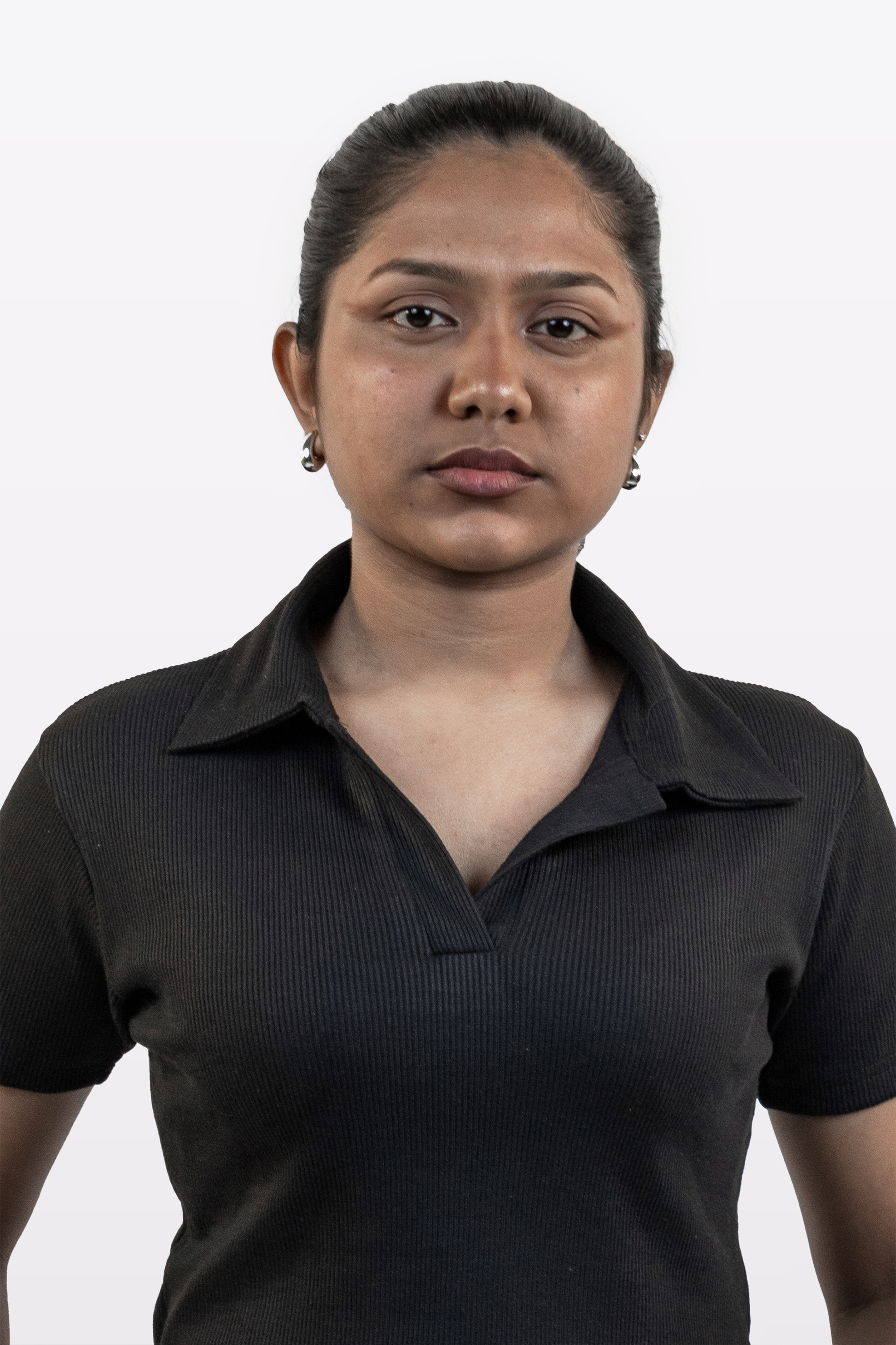 Portrait close up of model wearing Harper Slein ribbed black polo t-shirt, front view, on a white background