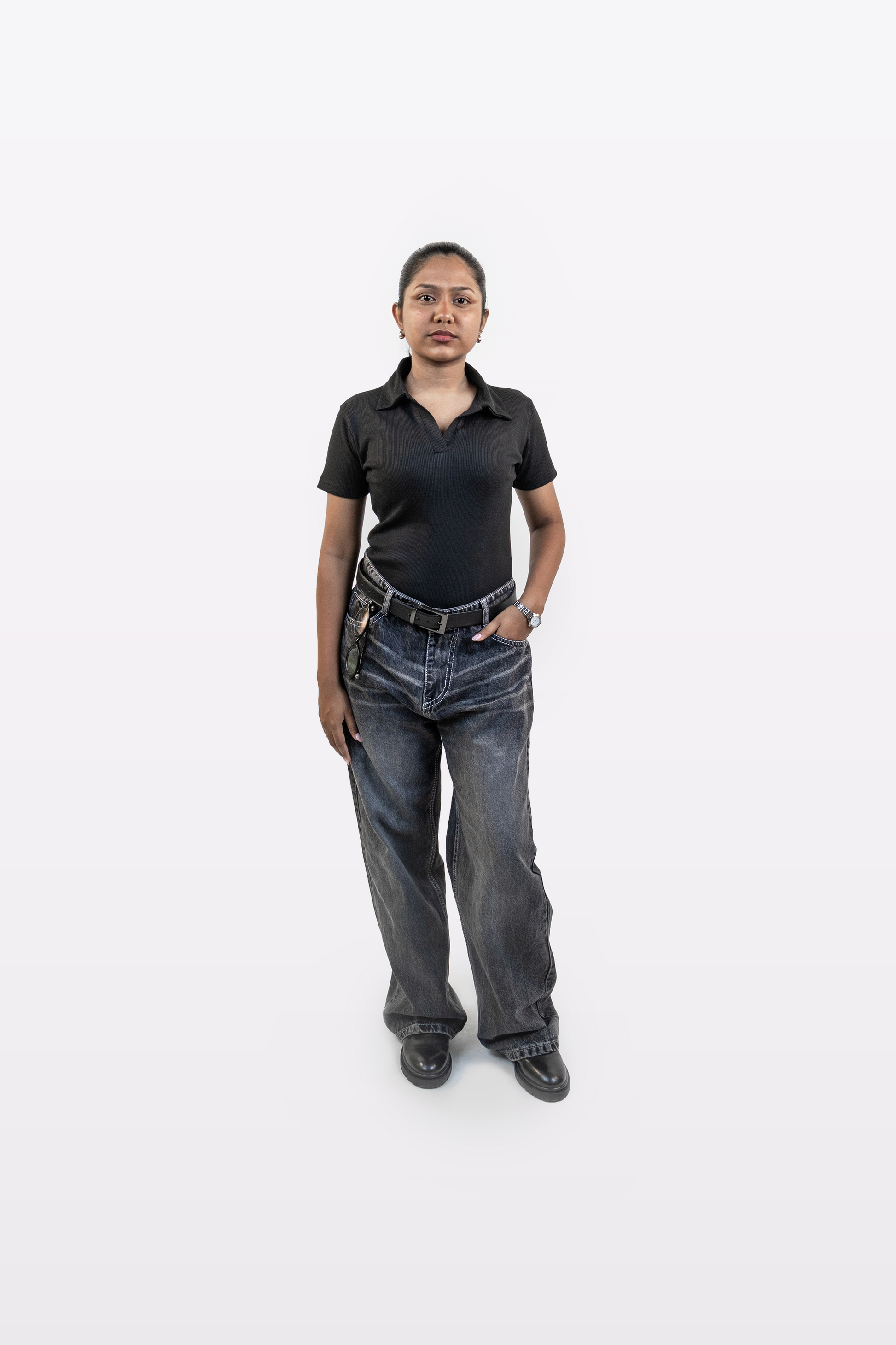 Model wearing Harper Slein ribbed black polo t-shirt styled with relaxed jeans, front view, on a white background