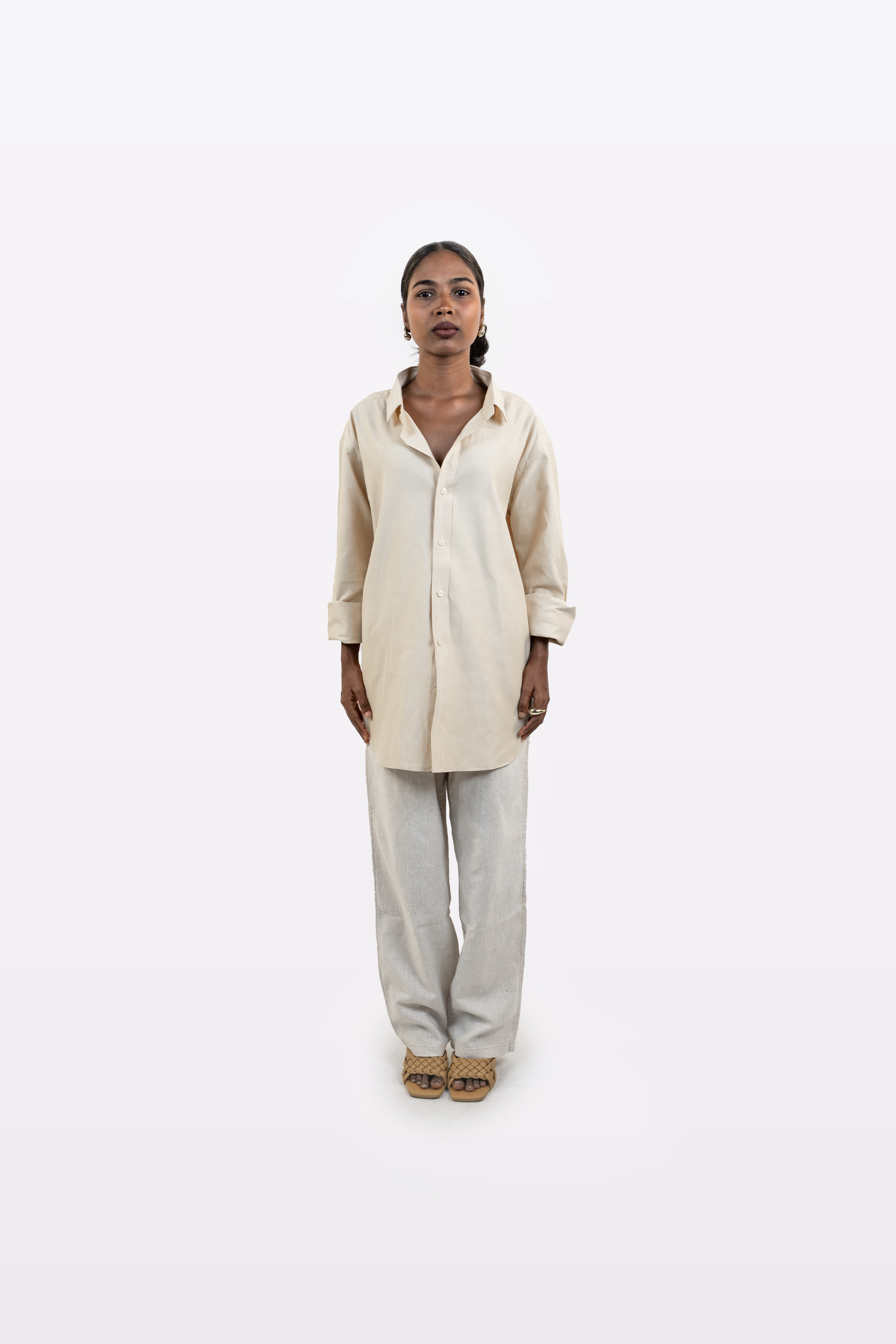 Front view of a model wearing the Harper Slein Off White Oxford Shirt with light grey trousers on a white background.