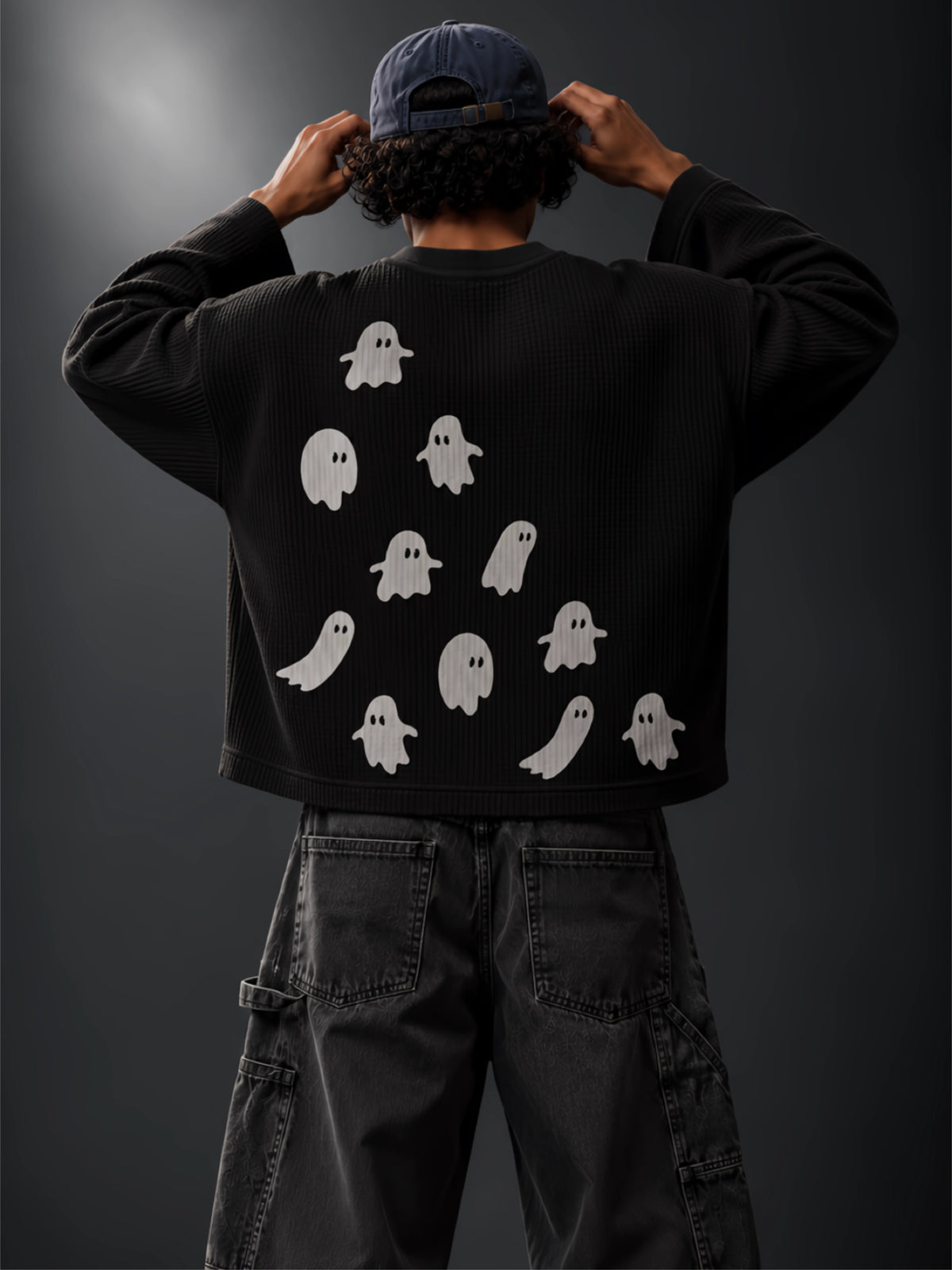 White ghost artwork on the back of the Afterlife black waffle-knit tee, worn by a model
