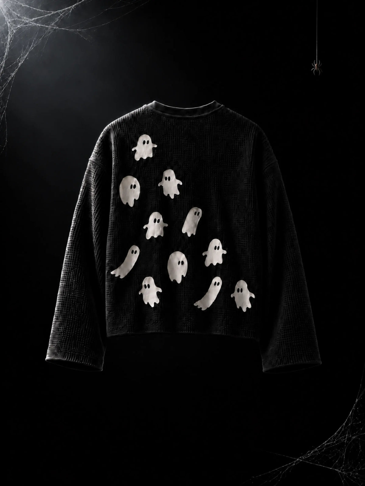 Afterlife black waffle-knit tee with white ghosts across the back, flat lay