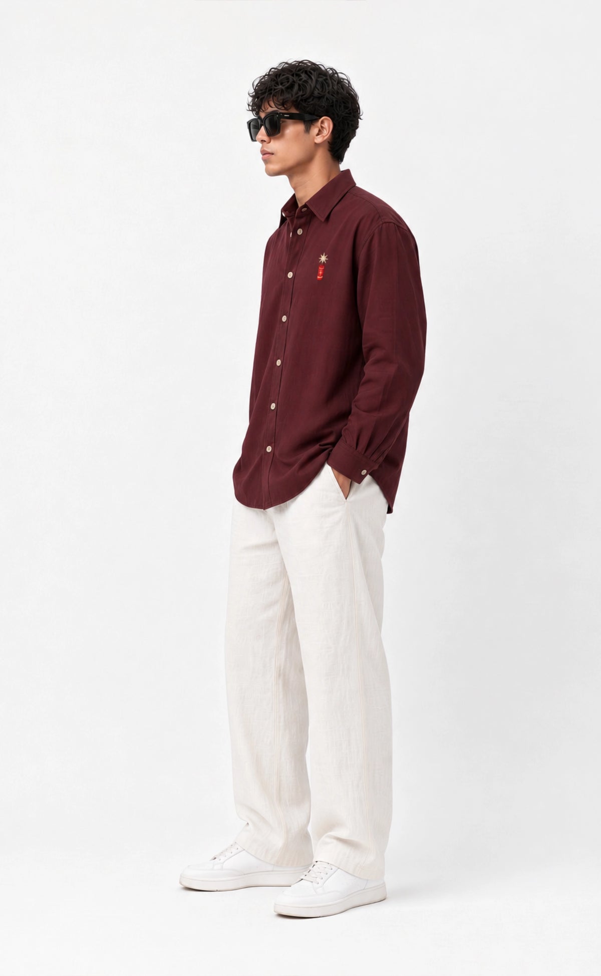 Burgundy cotton firecracker shirt worn by a model, side view